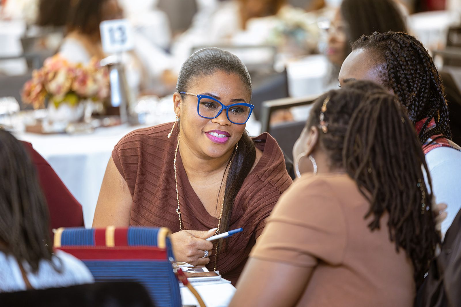 Women in conversation at a past UYB conference